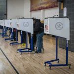 Stunning Admission: Votes Not Fully Safe Voters at polling booths in a gymnasium