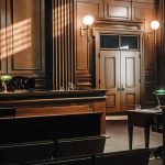 Legal Lawfare? Supreme Pass Leaves $5M Empty courtroom with wooden benches and judge's bench