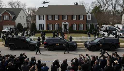 shutterstock_2755604505 FBI agents and SWAT team outside a house during an operation