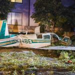 small airplane crash in residential area at night