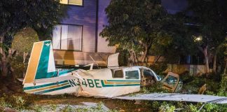 small airplane crash in residential area at night