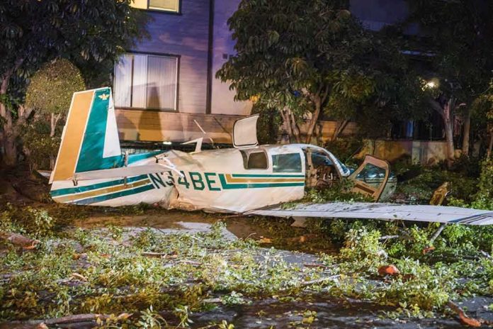shutterstock_1113505535 small airplane crash in residential area at night