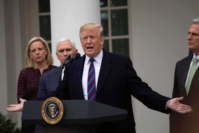 man speaking at podium with officials standing behind