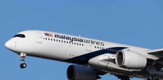 Malaysia Airlines jet on final approach with landing gear down