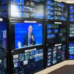 broadcast control room wall of monitors