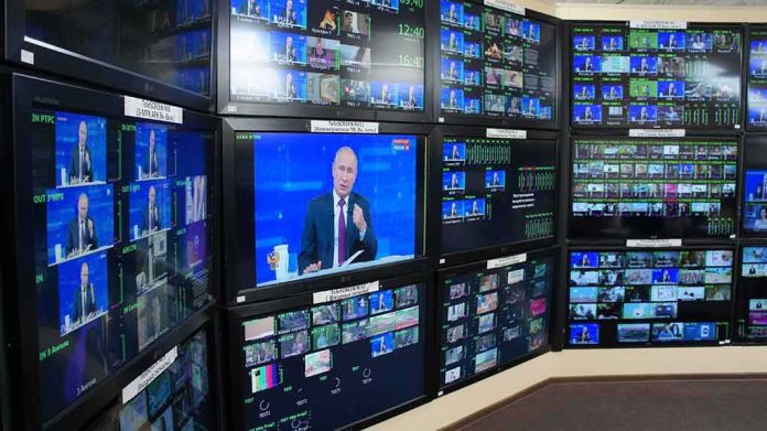 broadcast control room wall of monitors