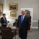 Washington Rules By Signature Now Donald Trump walks through an office with Sean Lawler nearby and Mariano Rajoy following behind