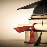 Hospitals Fooled: Fake Nurses Slip Through Graduation cap and diploma on stacked books