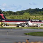 Abrupt Schedule Shifts Ignite Speculation Private jet with black and red livery parked on airport tarmac