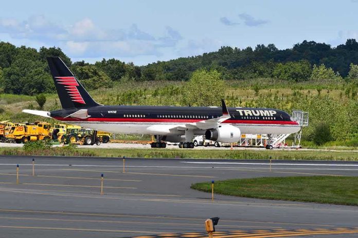 shutterstock_1626094870 Private jet with black and red livery parked on airport tarmac