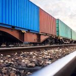 Gasoline Squeeze Rattles Russia’s Heartland Freight train with colorful shipping containers on railway tracks