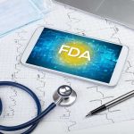 From Rescue Kitten To Baseball’s Newest Star Tablet with FDA on screen amid medical tools and ECG charts