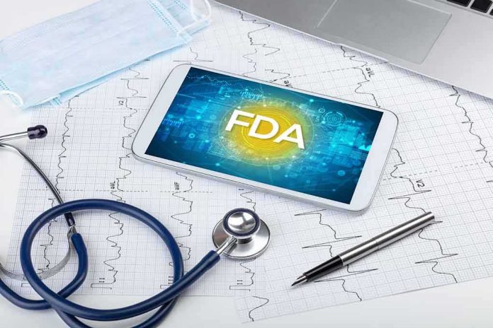 shutterstock_1701445117-1 Tablet with FDA on screen amid medical tools and ECG charts