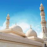 Mayor’s Holiday Bet Triggers Court Fight Mosque with domes and minarets against a clear blue sky