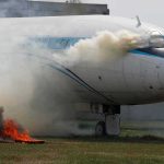 Airport Fire Rocks Riyadh – Flights Halted Airplane with smoke billowing from cockpit area