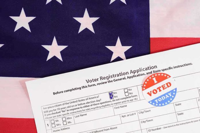 Voter registration form with I Voted sticker on American flag