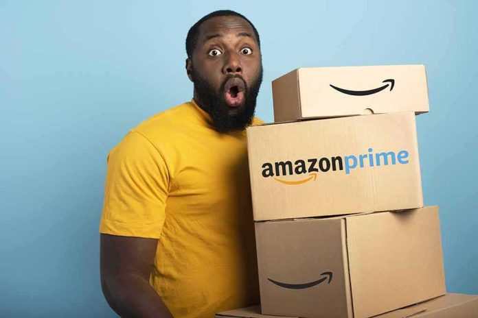 shutterstock_1810625878 Man in yellow shirt holding stack of Amazon Prime boxes