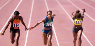 sprinters finish a race on an outdoor track