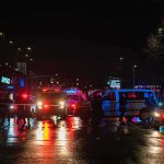 The Thailand Nightclub Pattern — Now 27 Dead at Na Ladprao Nighttime police scene with flashing lights on a wet city street