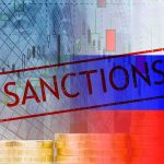 Sanctions text over financial chart and flag with coin stacks