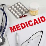 A $64 Million Fraud Case Ends With 76 Months Medicaid document with stethoscope and medications on desk