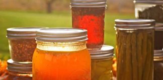 assorted canned goods in mason jars on a table