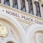 Nobel Peace Center facade with arched windows and gold medallion
