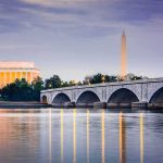Monument Mayhem: Olympian Indicted Arlington Memorial Bridge with monuments at dusk