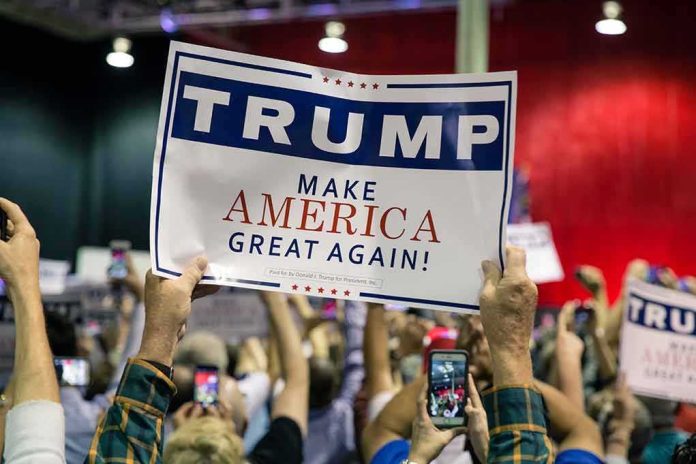 Crowd holding a political rally sign