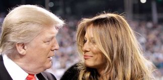 Donald Trump and Melania Trump looking at each other in a crowd