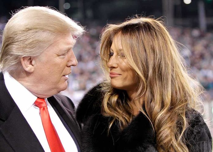 Donald Trump and Melania Trump looking at each other in a crowd