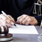 The Father Who Said His Daughter Did It — Before Any Charges Were Filed Judge writing at desk with gavel and Lady Justice statue