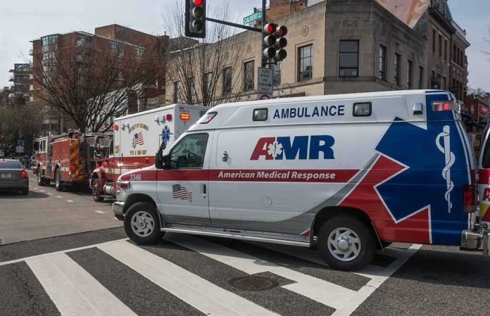 Ambulance and fire trucks at an urban intersection