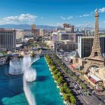 Las Vegas Strip skyline with fountains and Eiffel Tower replica