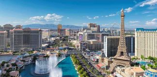Las Vegas Strip skyline with fountains and Eiffel Tower replica