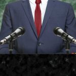 speaker at podium with microphones