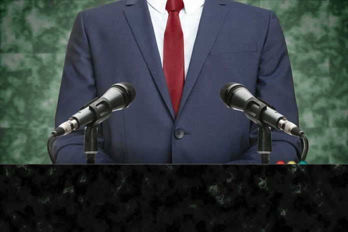 speaker at podium with microphones