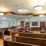 107,000 Messages Helped Convict Wife’s Killer Empty courtroom with wooden benches and judge's bench