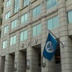 House Report Exposes 1,670 Detainer Failures U.S. government building facade with American and blue departmental flags