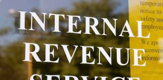 Internal Revenue Service sign on glass door