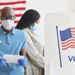 28 Noncitizens Charged in California Election Sweep Voters wearing masks at a polling station
