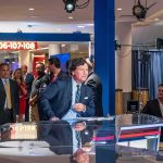 Conservative Civil War Erupts Over Ancient Law Tucker Carlson at a news desk with Carter Beauford among the onlookers