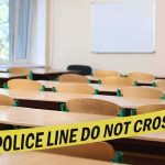 30-Year-Old Charged in Deadly School Shooting Plot Empty classroom with police tape across desks