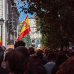 Tens of Thousands Protest After Housing Vote Crowd with Spanish flags in a city street