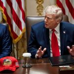 Democrats Sue Over $20 Million in Trump Ads Donald Trump speaks at a meeting table beside Marco Rubio