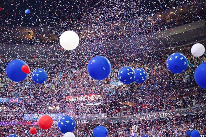 Blue and white balloons with confetti falling over a crowded indoor arena