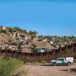 Federal Judge Stops Big Bend Border Project border fence with patrol truck in arid landscape