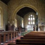 Church Shut After Video Invokes Terror Attackers Church interior with wooden pews and stained glass altar